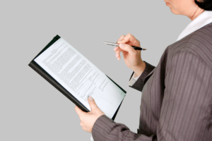 image of woman writing on paper