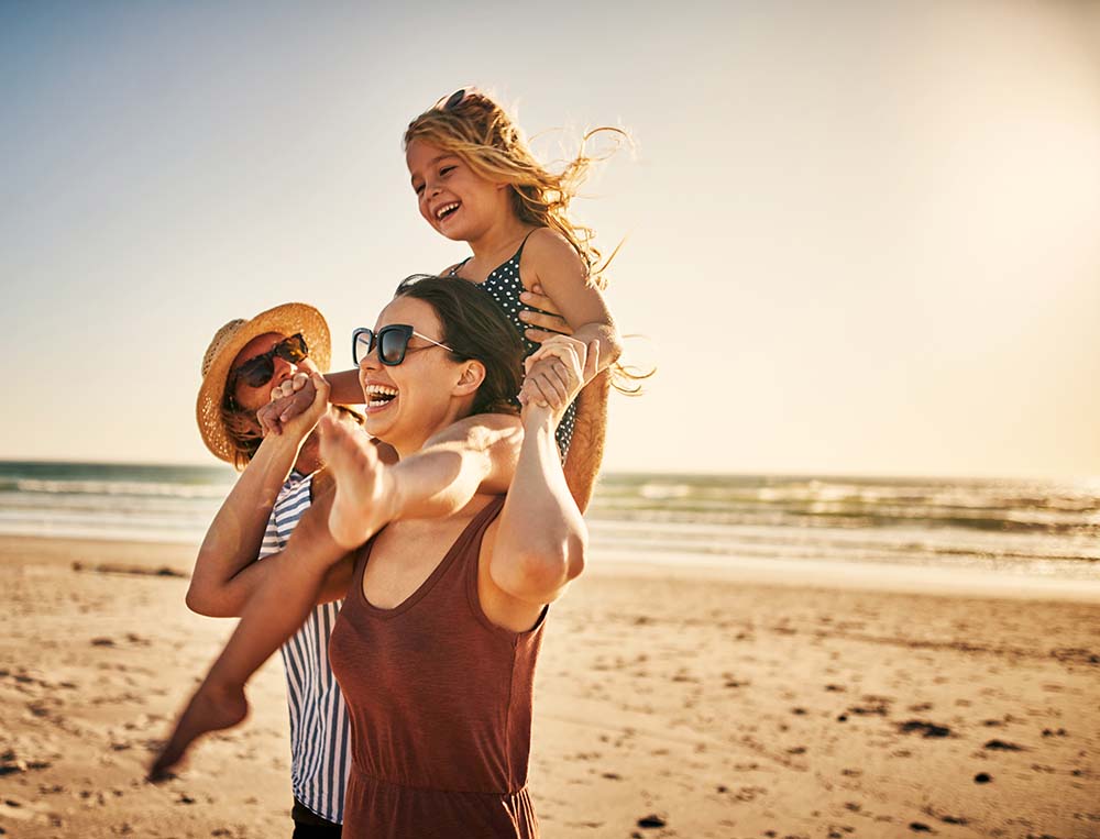 GCCU Club Accounts - Happy Family on Vacation at the Beach